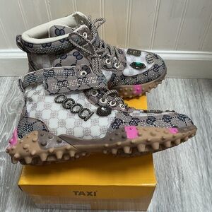 Taxi brand casual sneakers featuring a rhinestone-embellished monogram pattern